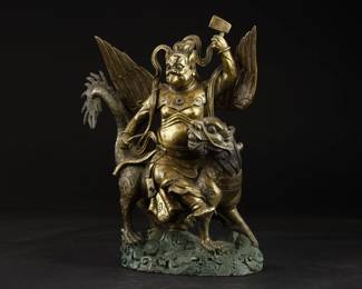 Qing Dynasty - Tibetan BUDDHA Gilt Bronze Statue (RARE)  A very rare beaked Buddha astride a mythical griffon, with a hammer or instrument in each and, and bedecked in finely detailed collar and garments. Matching lot 85.
Provenance: ex-William L. Parker heirloom collection, Naples, Florida, USA - inheritance from 1800s.
Dimensions:Height:34cm Length:26cm 