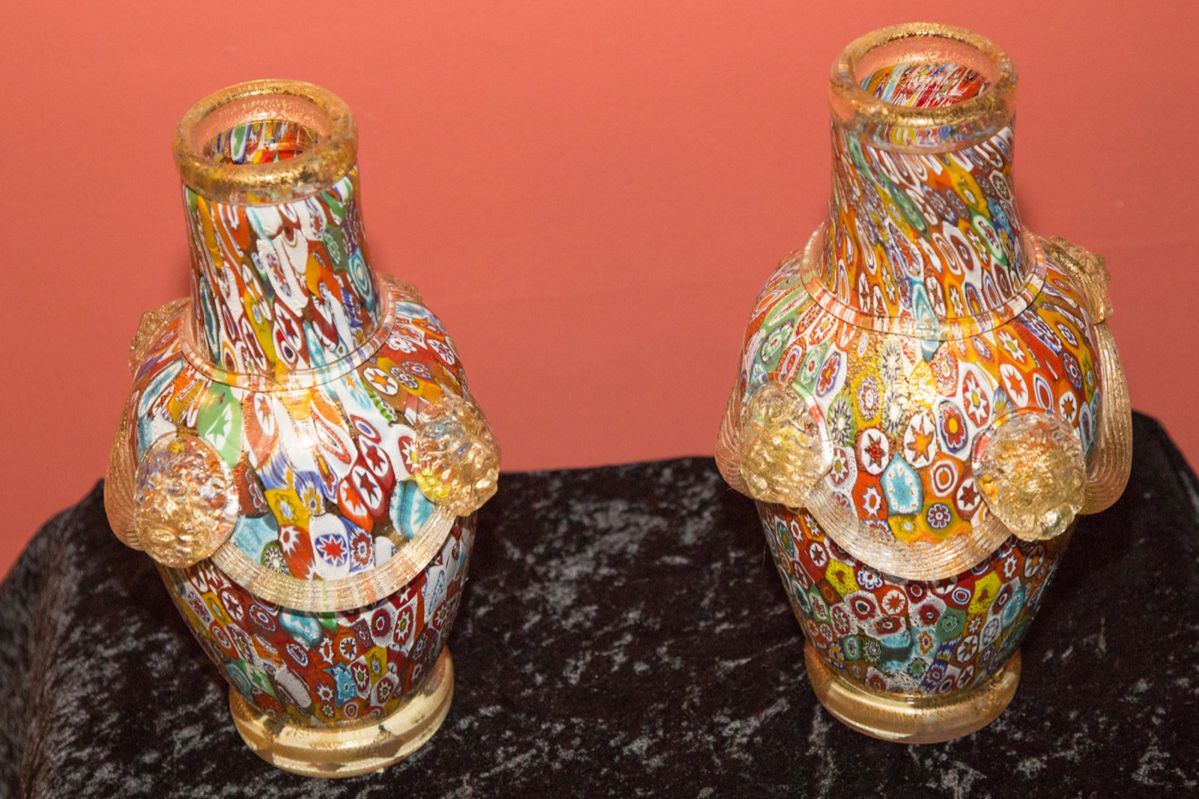 Murano Glass Vases/Baluster. Signed~ Alberto Dona 2001. Millefiori. Made in Italy. 11" tall. Lion head detail with gilt glass swags. $760.00 ea.