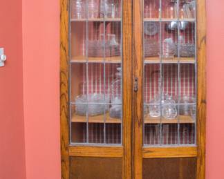 English Antique wood cabinet with lead glass window (6'3"h x 33.5"w x 12"d): $660.00