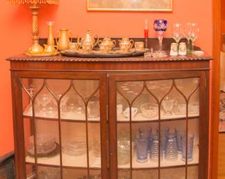 Antique Tiger Oak display cabinet (19th century Henry Aldridge & Son)  [49"h x 48"w x 13"d]:  $1,400.00.  Art:  Qing Dynasty Ancestor Portraits (31"l x 23" w):  $260.00 pair.  Glassware inside:  $1.00 - sets of Heisey Rose stemware 4 for $48.00...  Floral Indigo 10.5"plates @ $12.00 ea.