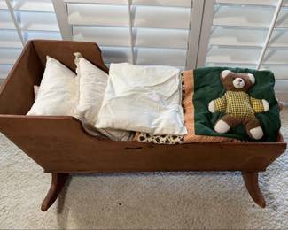 Antique Wooden Rocking Cradle With Pillows And Blanket