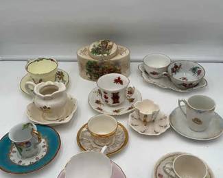 Lot of tea cups, plates, and vintage porcelain tea container