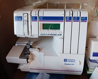 Several Viking Husqvarna sewing machines and sergers