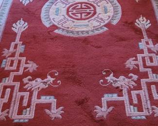 Rug #7 wool carved rug in red, tan, and celedon green 110" x 66", upstairs Master bedroom