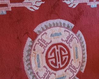 Rug #7 close-up of wool carved rug in red, tan, and celedon green 110" x 66", upstairs Master bedroom