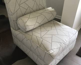 newly upholstered lounge chair with matching bolster pillow 