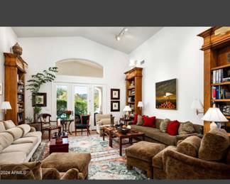 View of living room with 4 stunning 10’ foot shelves with lights BIG statement pieces for a custom finish for home or showroom