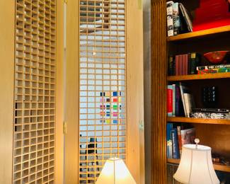 We have a pair of wood screens great for accent wall or space divider very unique & modern