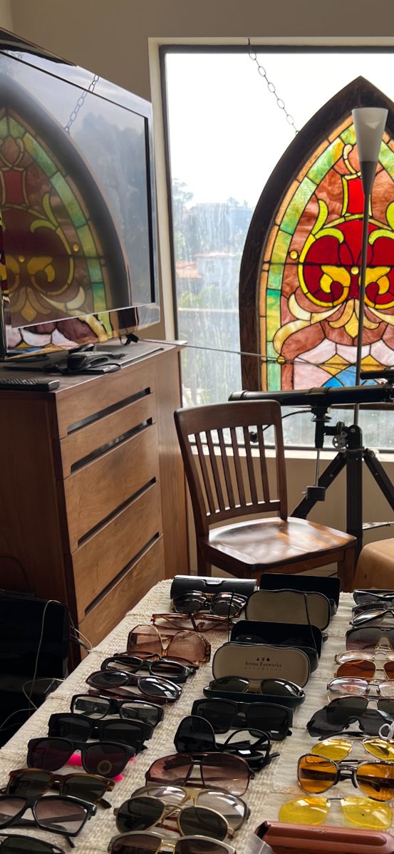 Mid Century armoir, Stained glass church window, telescope.  The sunglasses are pretty picked over.  Many shown here are sold.
