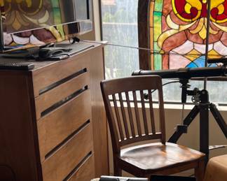 Mid Century armoir, Stained glass church window, telescope.  The sunglasses are pretty picked over.  Many shown here are sold.