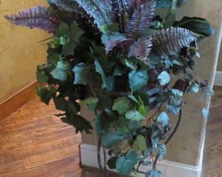 Wrought iron planter with stand and greenery
