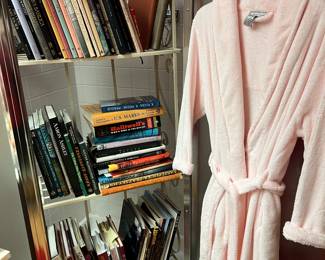 Books, bathrobe, bakers rack
