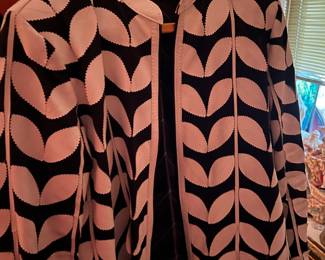 GREAT LADIES JACKET W ITH LEATHER LEAVES - ACTUAL COLOR WHITE ON BLACK SIZE XL.  A SECOND ONE IS ORANGE ON BLACK SIZE L.  LIGHTING IS TRICKY