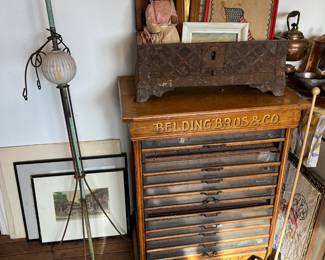 Antique Belding Bros spool cabinet, lighting rod, needlepoint and artwork