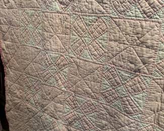 detail of the pink and white quilt