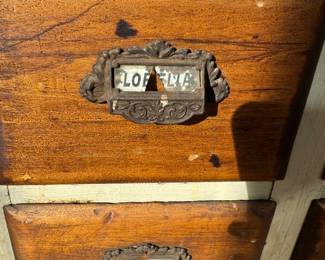 Detail on one of the apothecary cabinets, believed to be from the area