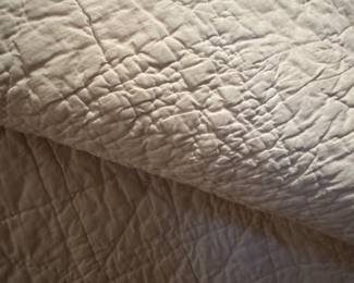 back side of pink and white quilt