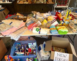 Cleaning supplies, dish towels, placemats and table cloths. 