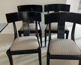 Eight (8) black lacquered dining chairs $800