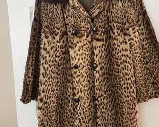Leopard pelt swing coat with mink collar, 3/4 length sleeves, pockets. M/L These fur coats from a well known local estate are back on the market! Ferris Furs, Pensacola, Fl original label.   Contact me for prices on the fur coats