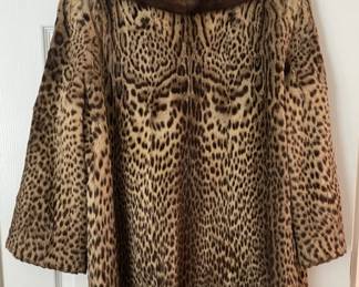 Leopard pelt swing coat with mink collar, 3/4 length sleeves, pockets. These fur coats from a well known local estate are back on the market! Ferris Furs, Pensacola, Fl original label.   Contact me for prices on the fur coats