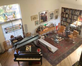 Den filled with van der Rohe, Eames, Art, Books and More