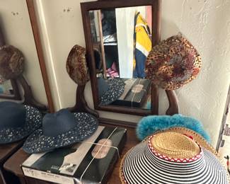 hats and dresser with mirror 