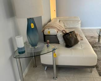 Gorgeous cream leather sectional sofa in mint condition has storage on the arm and back, and can be attached or split to create two pieces (each sold separately).