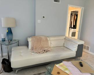 Gorgeous cream leather sectional sofa in mint condition has storage on the arm and back, and can be attached or split to create two pieces (each sold separately).