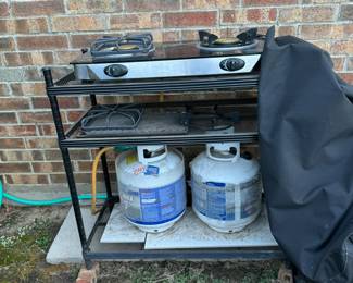 Two burner mini stove with two bottles of propane. Great for an outdoor/ field kitchen!