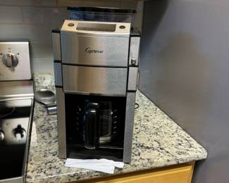 Capresso coffee maker with built in bean grinder in the top. Makes excellent coffee!