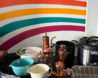 Vintage cast iron pieces, French presses, mixing bowls