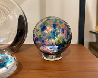 This glass orb holds little wishes on notes