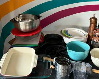 Measuring cups, mixing bowls, small cutting boards, cast iron cornbread skillet, cast iron skillet