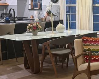 This STUNNING dining table is unassembled: white glass top on "infinity" wood legs