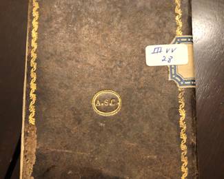 Front of antique book containing hand written manuscript of Baqashot songs $500