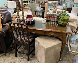 Queen Anne desk with leather top, needlepoint antique chair, pair of ultra suede ottomans. 