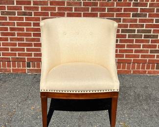 Cream upholstered barrell back chair