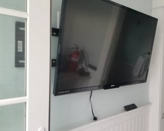 Flat screen TV with wall mount bracket
