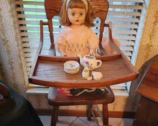 Old doll and Antique highchair