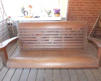 Comfortable wooden porch swing