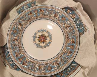 A close up of the Turquoise Wedgwood pattern. It has been stored in bags, buyer can have the zip up storage bags