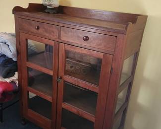 Nice piece safe type cabinet with glass replacements. Stunning piece