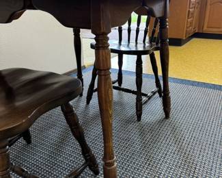 Kitchen dining table with two chairs.