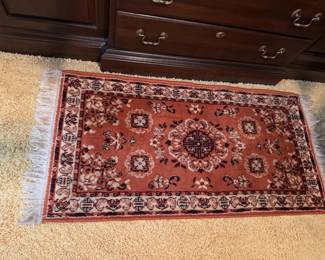 Asian inspired apricot area rug.
