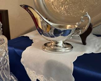 Silverplate gravy boat and large tray.