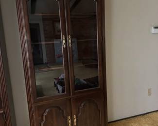 Cherry book/ curio shelf glass front with two shelf covered storage. 