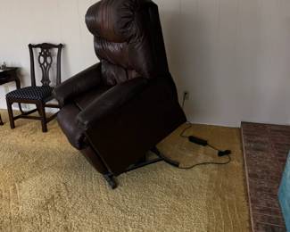 Almost new chocolate leather lift chair. Works great!