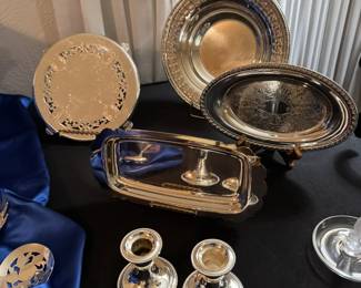 Silverplate trays, candlesticks, serving pieces.