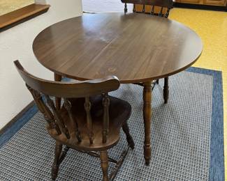 Kitchen dining table with two chairs.